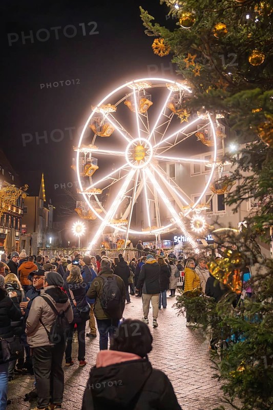 Illuminated Ferris wheel with people at a Christmas market in a festive atmosphere, Weihnachtsmark Nagold, LandkreisCalw, Germany