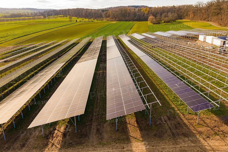 Rows of solar panels arranged in green fields, energy revolution, construction of PV open space, Baden-Württemberg, Germany
