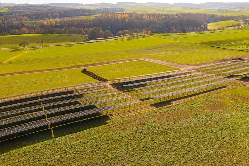 Incomplete solar panel structures on a green area in a vast landscape, energy revolution, construction of PV open space, Baden-Württemberg, Germany