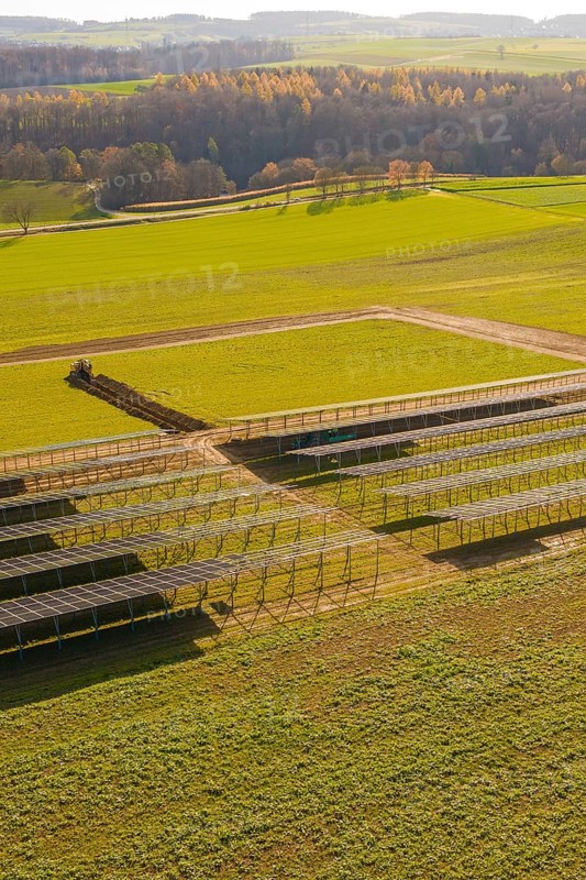 Incomplete solar park with empty structures and green land in autumn, energy revolution, construction of PV open space, Baden-Württemberg, Germany