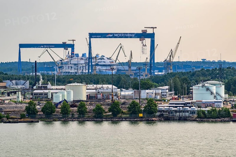 Industrial harbor scene with cranes and shipyards on the water, Meyer Werft, Turku, Finland