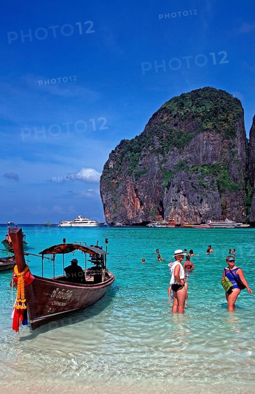 People, longtail boat on Maya Bay beach, known from the movie The Beach, one year in front of the tsunami, Ko Phi Phi Le, Thailand, December 2002, vintage, retro, old, historic