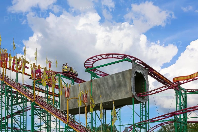Wilde Maus, little rollercoaster for children, fairground in Friedrichsau Ulm, public festival, hustle and bustle, fair, amusement park, amusement attraction, ride, blue sky, clouds, Ulm, Baden-Württemberg, Germany