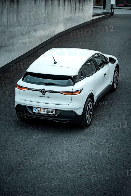 Rear view of a white modern SUV on a paved road, Deer e-car sharing, Renault Megane, Calw, Germany