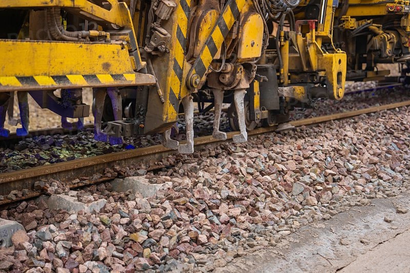 Close-up of technical devices working on train tracks, tamping machine on Hermann, Hesse, Bahn, Althengstett, Calw district, Germany