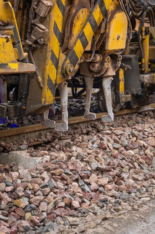 Close up of a construction machine used for track work on gravel, tamping machine on Hermann, Hesse, Bahn, Althengstett, Calw district, Germany
