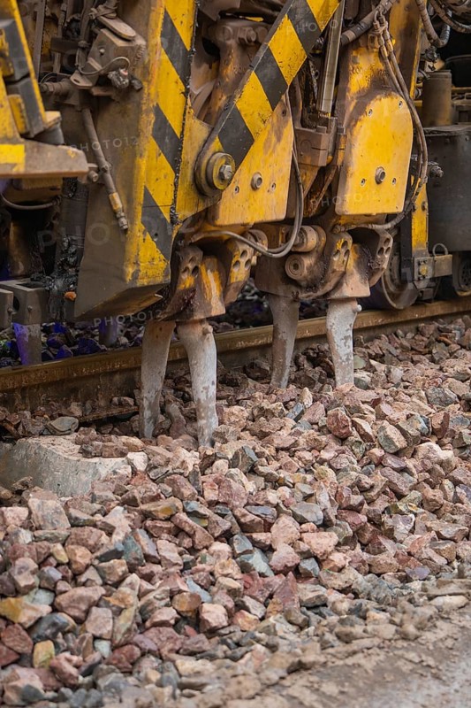 Detailed view of a gravel and track construction machine with yellow-black painting, stuffing machine on Hermann, Hesse, railway, Althengstett, Calw district, Germany