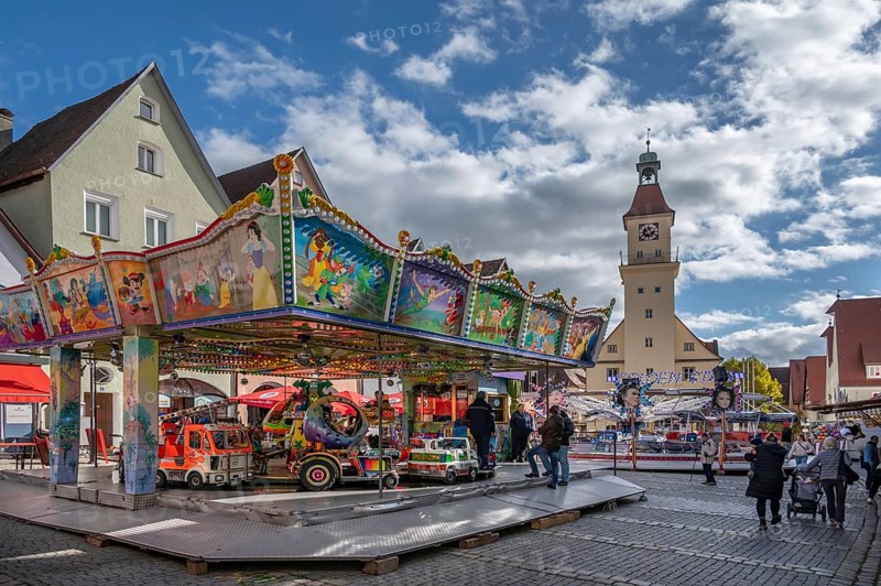 Children's carousel at the town festival on the market square, in the back the town hall, building from the 13th to 18th century, Unterer Markt, Hersbruck, Middle Franconia, Bavaria, Germany