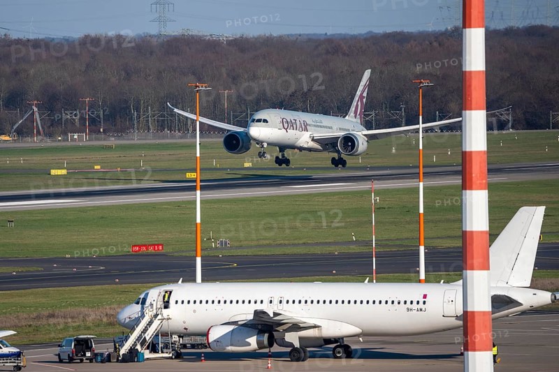 Düsseldorf airport, Qatar Airways Boeing 787 Dreamliner landing, Eurowings aircraft on the apron, Taxiway, North Rhine-Westphalia, Germany