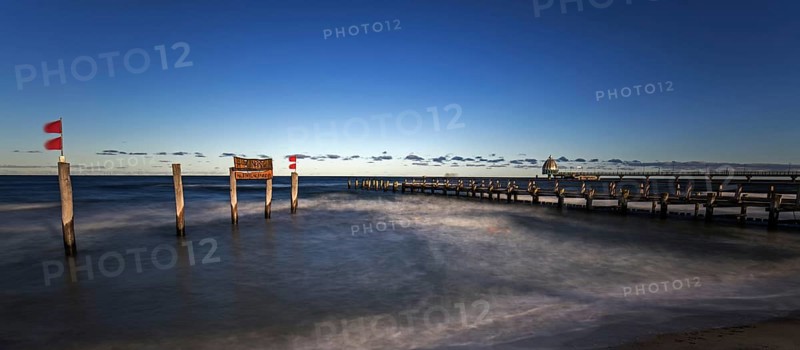 Wooden sign in the sea with inscription Zingst and Holzsteg, panorama, long exposure, evening light, Zingst, Fischland-Darß-Zingst, Western Pomerania Lagoon Area National Park, Mecklenburg-Western Pomerania, Germany