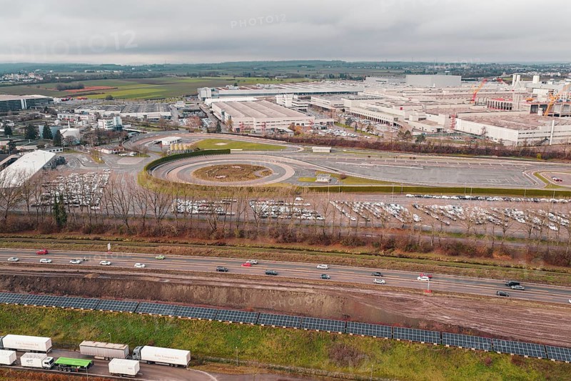 Extensive Daimler Benz industrial area with roads and parking lots under a cloudy sky, Böblingen, Germany