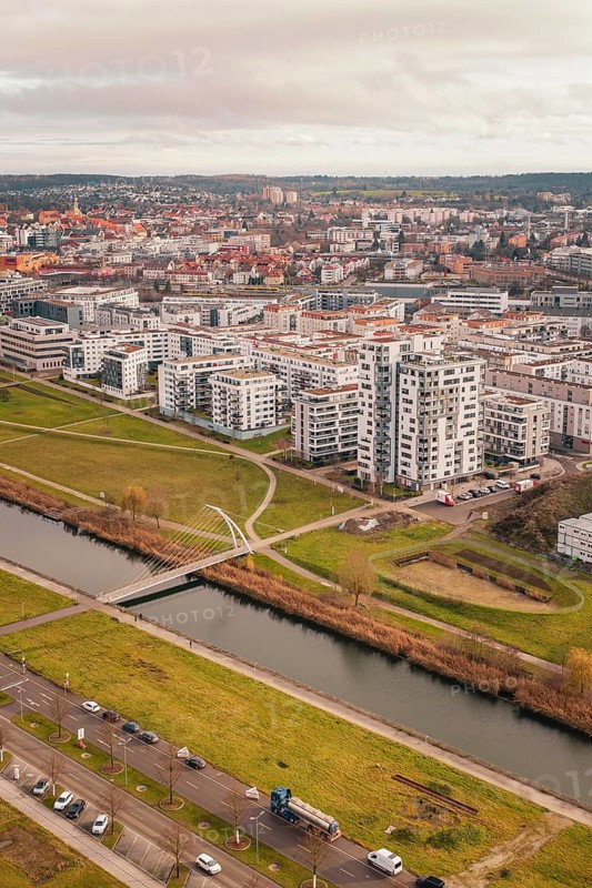 Large residential complex with modern buildings on a canal and adjacent green spaces, Böblingen, Germany