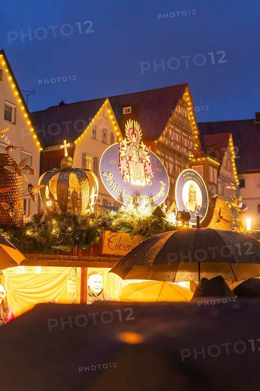 Illuminated Christmas decorations and decorated roofs at a night market, Böblingen Christmas market, Germany