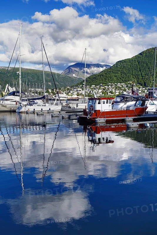 Harbour view with boats and reflections in the water, Tromso