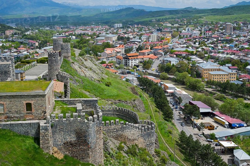 Panorama of a city with historic castle ruins on a hill under cloudy sky, Rabati Fortress, Akhaltsikhe, Samtskhe-Javakheti region, Samtskhe-Javakheti, Georgia