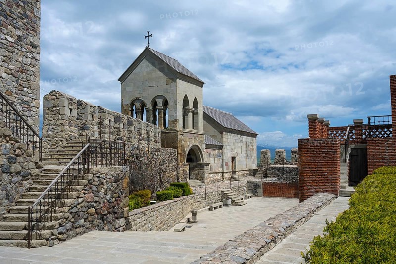Stone complex with stairs, a church entrance and an open courtyard under cloudy sky, Rabati Fortress, Akhaltsikhe, Samtskhe-Javakheti region, Samtskhe-Javakheti, Georgia