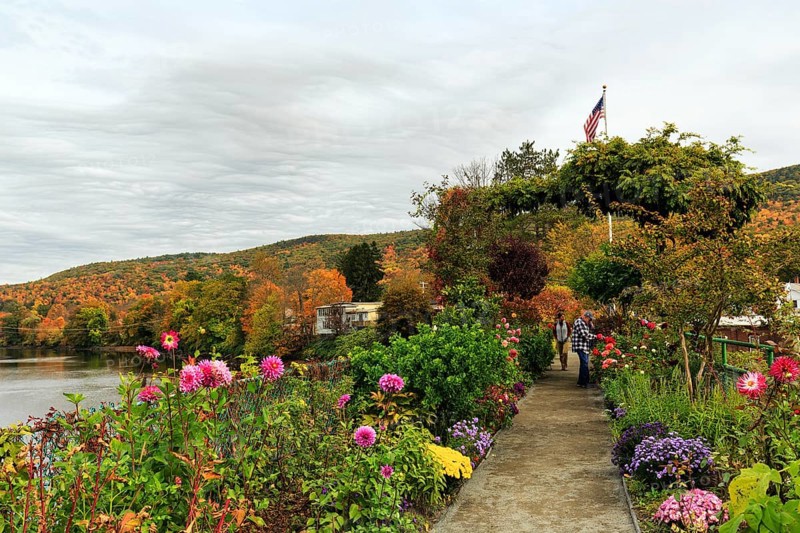 Flower bridge, Bridge of Flowers, bridge over Deerfield River, gardens, riverscape, walkers, autumn leaves, Indian summer, Mohawk Trail panoramic road, former trade route, Shelburne Falls, Massachusetts, New England, USA