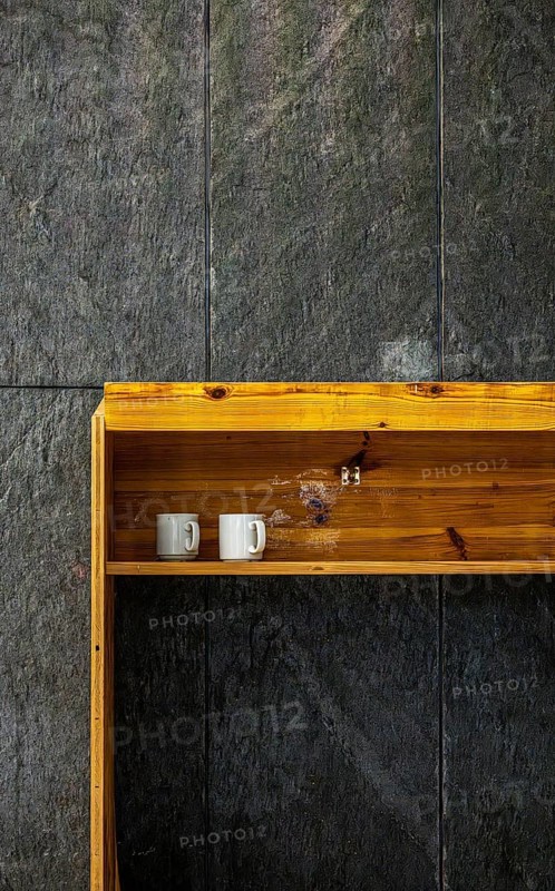 Temporary wooden rack with empty coffee cups on an interior construction site, Berlin, Germany