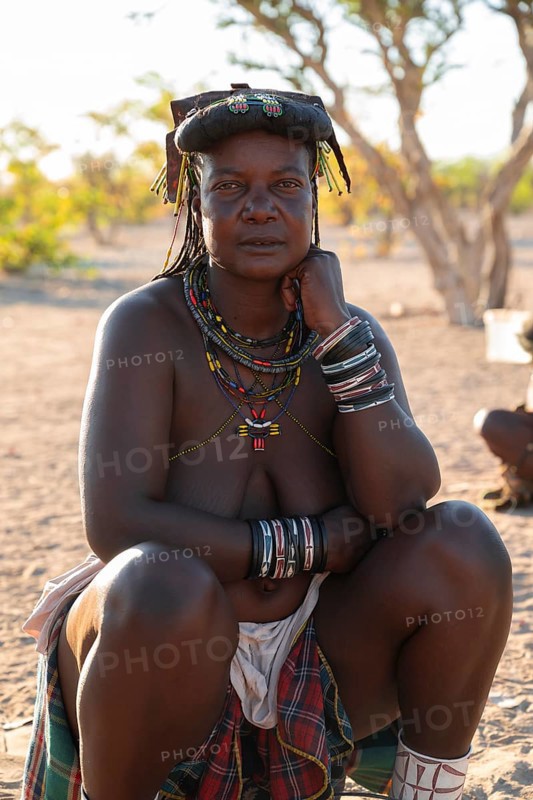Portrait, brightly decorated woman of the Hakaona tribe, also Havakona or Hakawona, near Opuwo, Kunene, Namibia