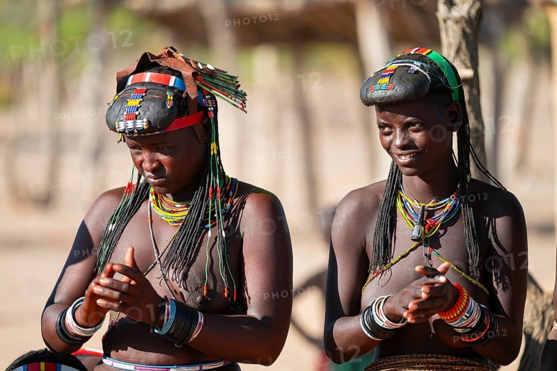 Traditional dance, brightly decorated woman of the Hakaona tribe, also Havakona or Hakawona, near Opuwo, Kunene, Namibia