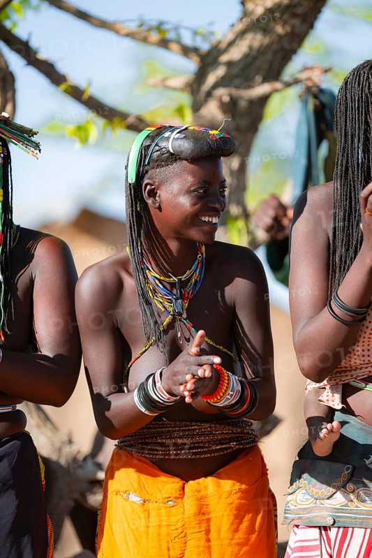 Traditional dance, brightly decorated woman of the Hakaona tribe also dance Havakona or Hakawona, near Opuwo, Kunene, Namibia
