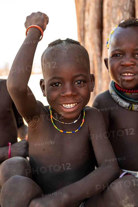 Portrait, funny Himba child, traditional Himba village, Kaokoveld, Kunene, Namibia
