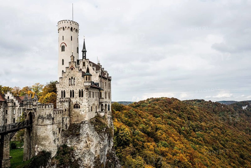 Castle and autumnal forest, Lichtenstein Castle, Honau, Echaz Valley, Swabian Jura, Baden-Württemberg, Germany