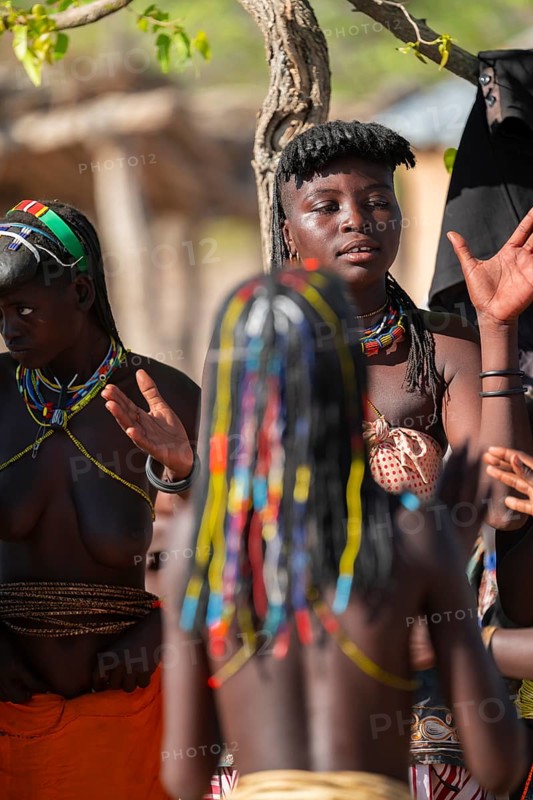 Traditional dance, brightly decorated woman of the Hakaona tribe, also Havakona or Hakawona, near Opuwo, Kunene, Namibia