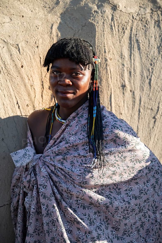 Portrait, brightly decorated woman of the Hakaona tribe, also Havakona or Hakawona, near Opuwo, Kunene, Namibia