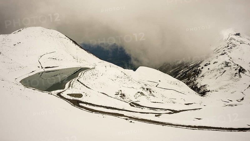 Another onset of winter in May, Riezler Alpsee, an artificially created lake, snow pond, feeds the snow cannons that completely snow the slopes of the Fellhorn and Kanzelwand cable cars, Allgäu Alps, Vorarlberg, Austria