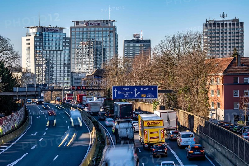 The A40 motorway, Ruhrschnellweg, in Essen, city skyline, Evonik office building, traffic jam in the westbound lane, Duisburg, slow traffic, North Rhine-Westphalia, Germany
