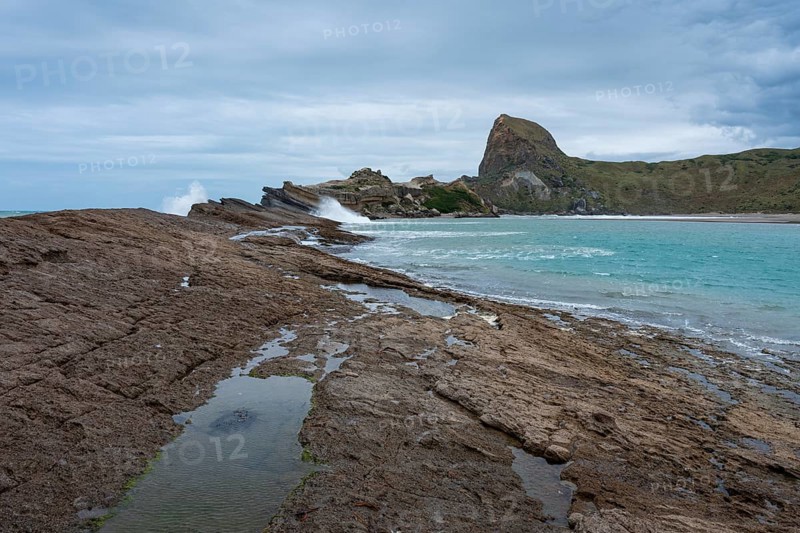 Deliverance Cove and Castle Rock, rocks, ocean, surf. Castlepoint, Wairarapa Coast, Wellington Region, North Island, New Zealand