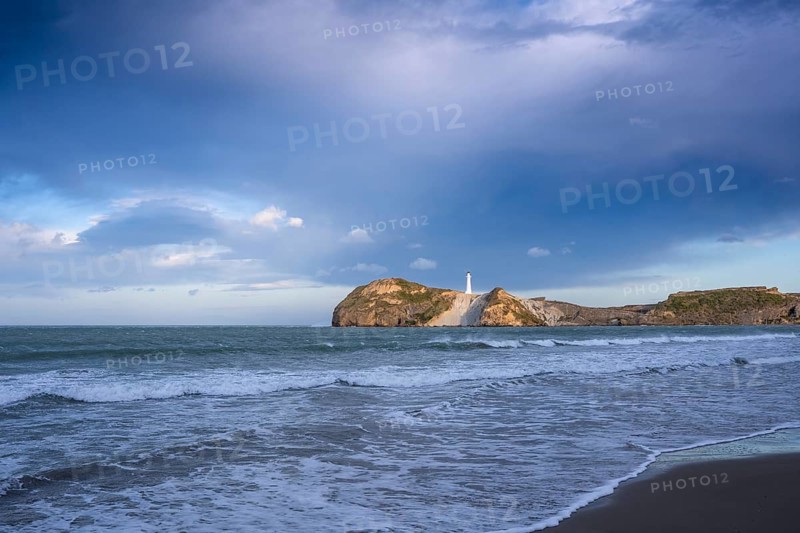 Castlepoint Beach, ocean and lighthouse on a rock. Castlepoint, Wairarapa Coast, Wellington Region, North Island, New Zealand