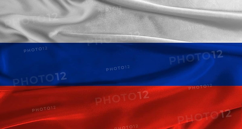 Flag of Russia with fabric textured background. Close up of National flag of Russia with realistic texture