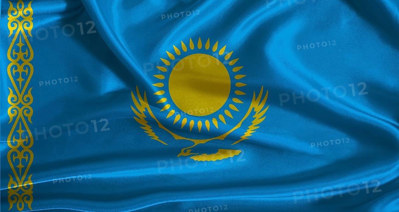 Kazakhstan flag with cloth textured background. National flag of Kazakhstan with realistic texture