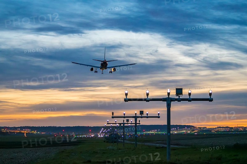 Arrival over brightly lit runway at dusk, Stuttgart Airport, Leinfelden-Echterdingen, Baden-Württemberg, Germany