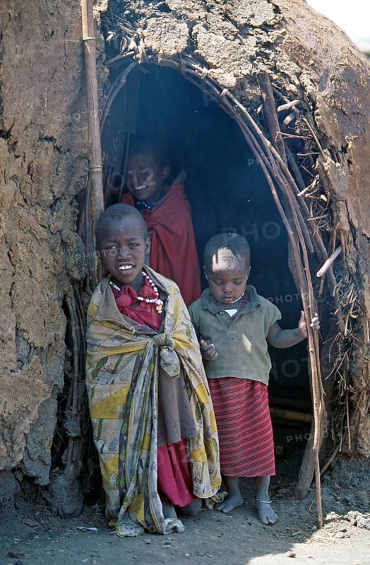 Maasai children in front of a hut in their village in the Ngorongoro Crater, Tanzania, June 2000, vintage, retro, old, historic