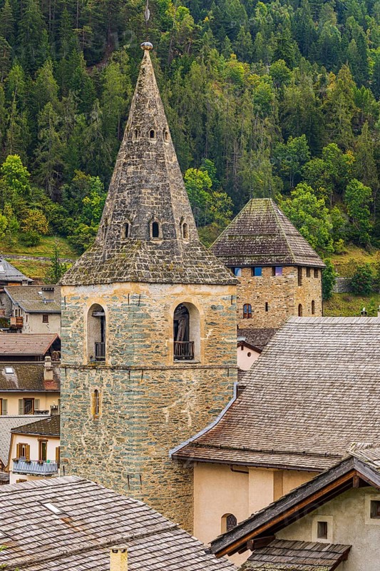 Church tower of the Sainte-Euphemie church and behind it the tower of Anniviers, also known as Episcopal Tower, Vissoie, Val d'Anniviers, Valais Alps, Canton of Valais, Switzerland