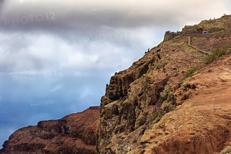 Dramatic cliffs above the sea under a cloudy sky, Haria Lanzarote, Canary Island