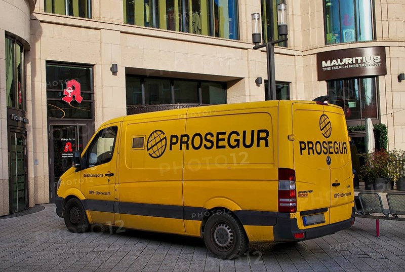 Exterior view of yellow Prosegur cash transporter, security service, logo, parked in front of Das Gerber shopping center, pharmacy, restaurant Mauritius, Stuttgart, Baden-Württemberg, Germany