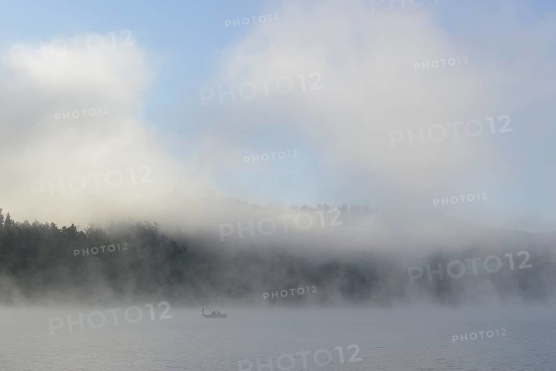Hennesee, fog, rising clouds of fog, anglers in the boat, blue sky, Hennetalsperre, Sauerland-Rothaargebirge nature park Park, North Rhine-Westphalia, Germany