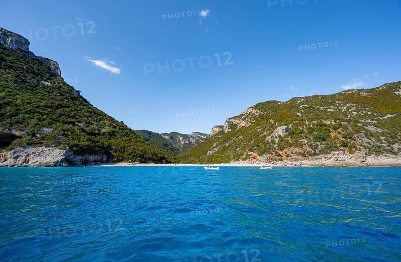 Picturesque rocky coast with Cala Sisine beach, cliffs and blue sea, Golfo di Orosei, Baunei, Sardinia, Italy