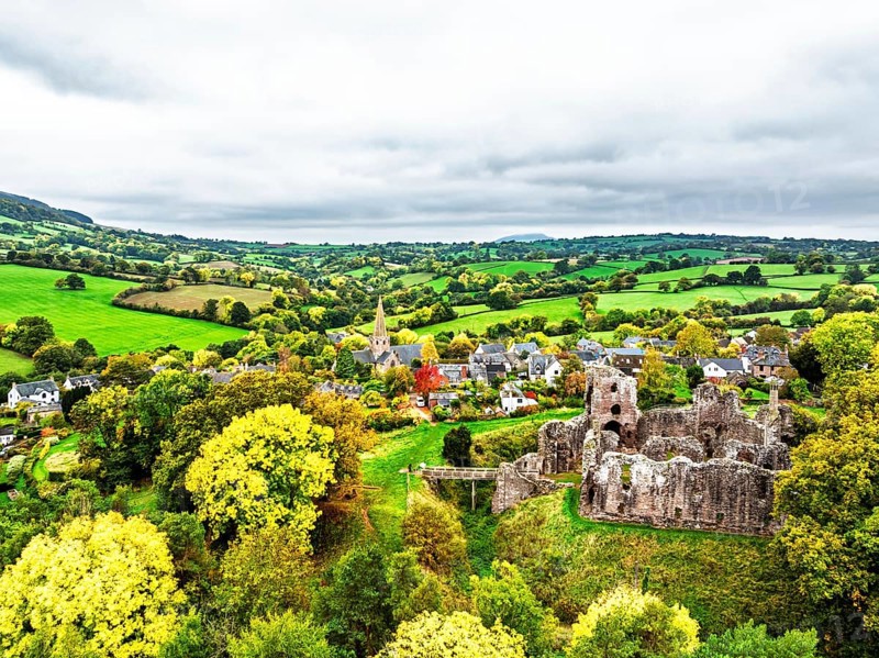 Autumn Colours over ruins of Grosmont Castle from a drone, Grosmont, Monmouthshire, Wales, UK