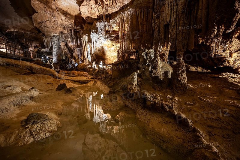 Stalactites and stalagmites, small underground lake, rock formations in a stalactite cave, Grotta del Fico, Gulf of Orosei, Baunei, Sardinia, Italy