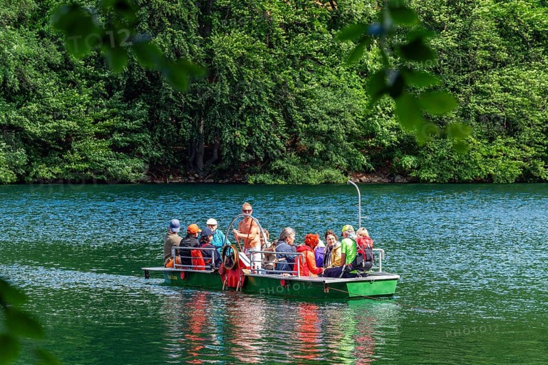 Manually operated ferry with ferryman and passengers, Lake Schmaler Luzin, Feldberg Lake District, Mecklenburg Lake District, Mecklenburg-Western Pomerania, Germany