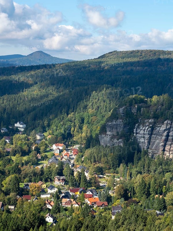 Mountain landscape with forest, rocks and village, view of Oybin, Zittau Mountains, Saxony, Germany
