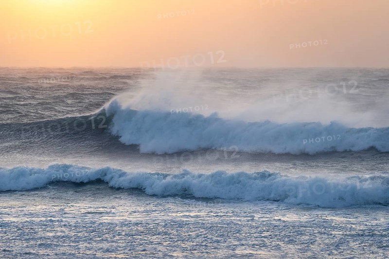 Ocean waves, strong surf, sunset, west coast of the Taranaki region, North Island, New Zealand