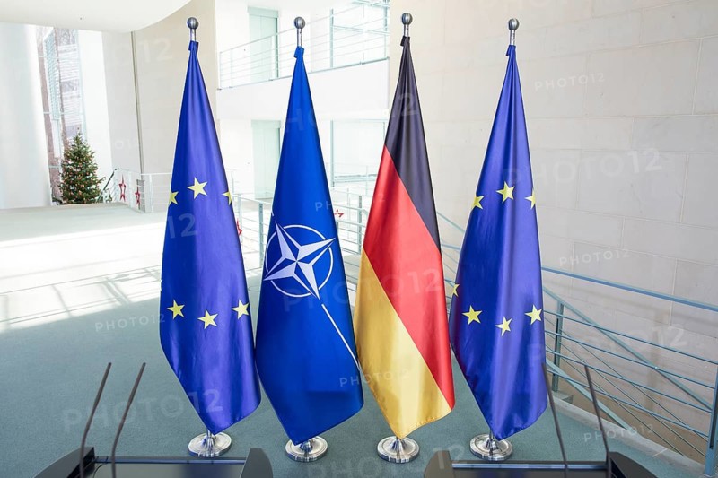 Flags of the Federal Republic of Germany, the EU and NATO after a press conference by Mark Rutte (Secretary General of NATO) and Friedrich Merz (Chancellor of the Federal Republic of Germany, CDU) following a one-on-one meeting at the Federal Chancellery, Berlin, 11 December 2025