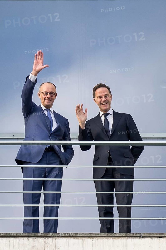 Friedrich Merz (Chancellor of the Federal Republic of Germany, CDU) and Mark Rutte (Secretary General of NATO) wave from the terrace in front of a joint one-on-one meeting at the Federal Chancellery, Berlin, 11 December 2025