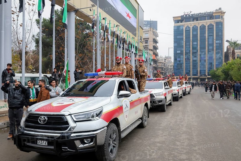 Aleppo, Syria – December 08, 2025: The Syrian Army and Public Security forces hold a military parade marking the first anniversary of the Syrian revolution's victory and the fall of the Assad regime, attended by thousands of people, Aleppo, Aleppo, Syria